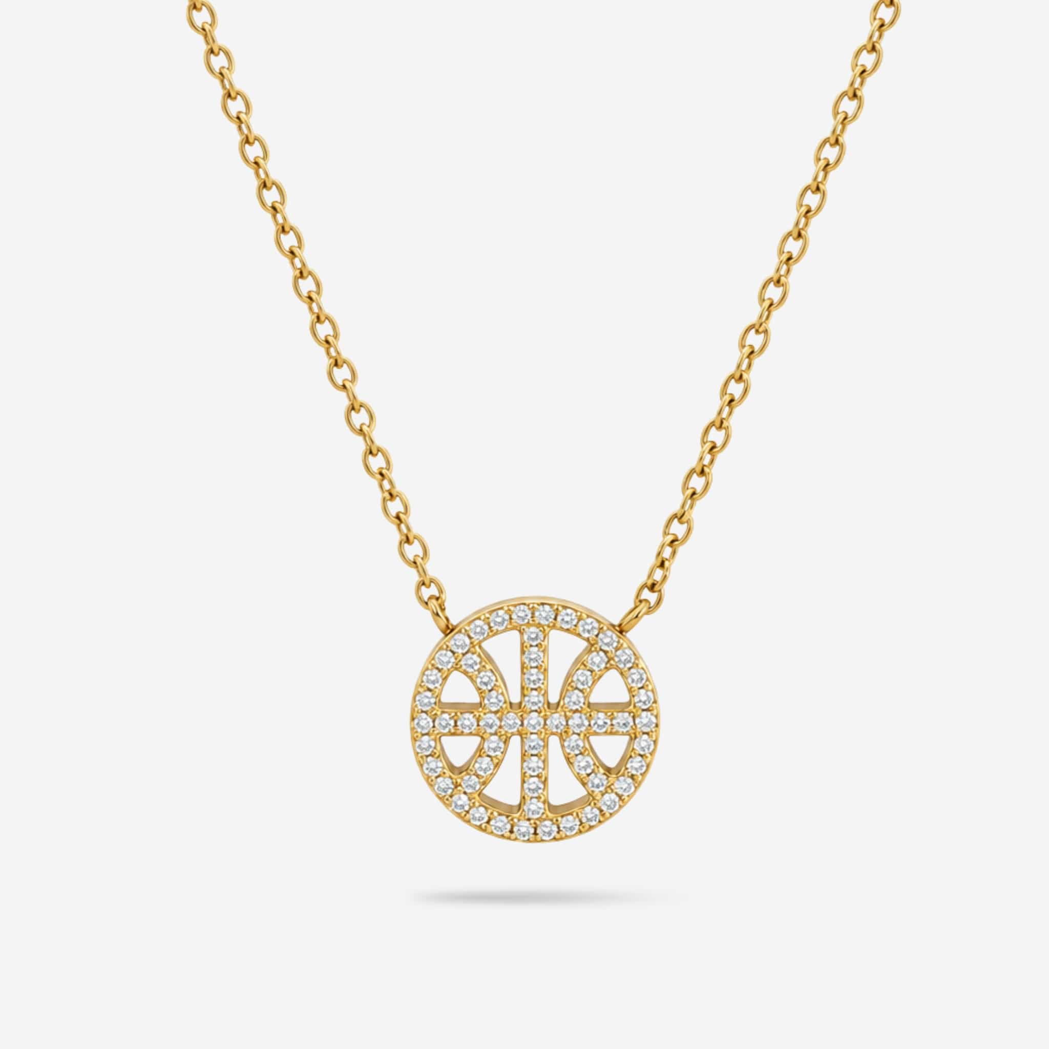 A gold chain necklace with a circular pendant featuring a basketball design paved with small clear stones, shown on a light gray background.