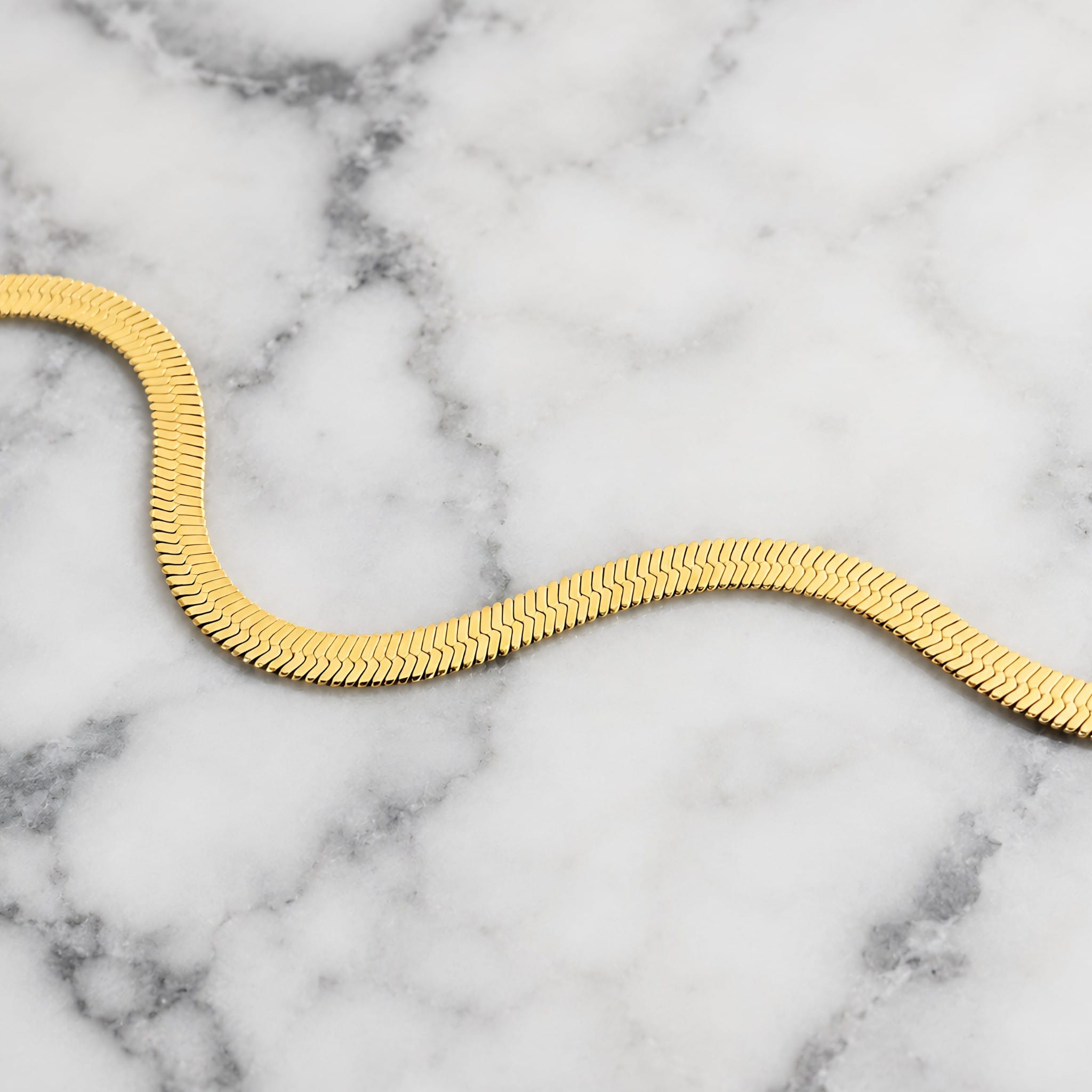 herringbone chain on marble background
