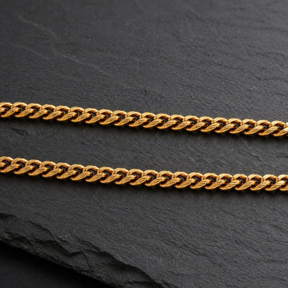 cuban chain link necklace on black background