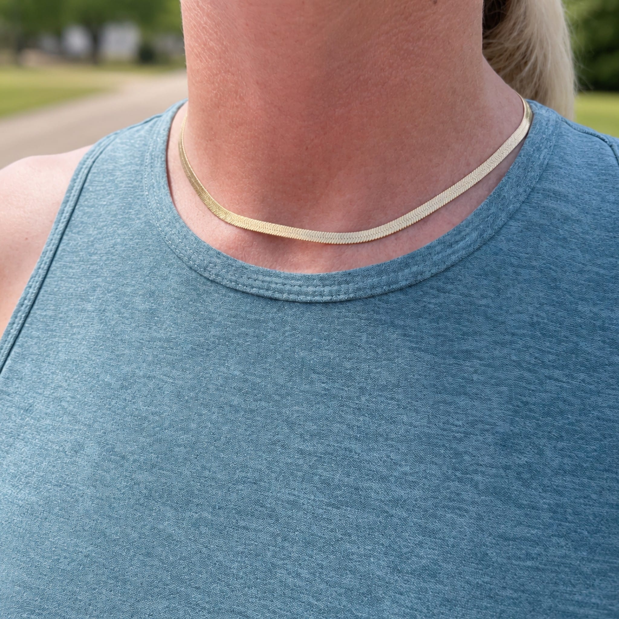 model outside wearing herringbone chain