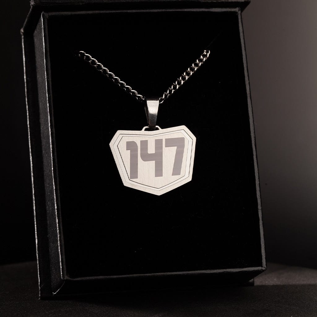 silver motocross pendant