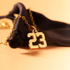 small number charm gold