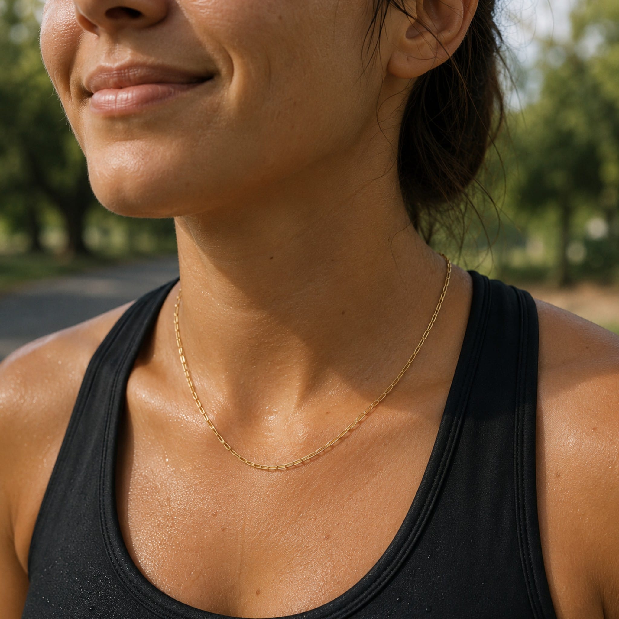 model wearing gold paperclip chain