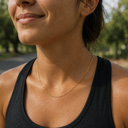 model wearing gold paperclip chain