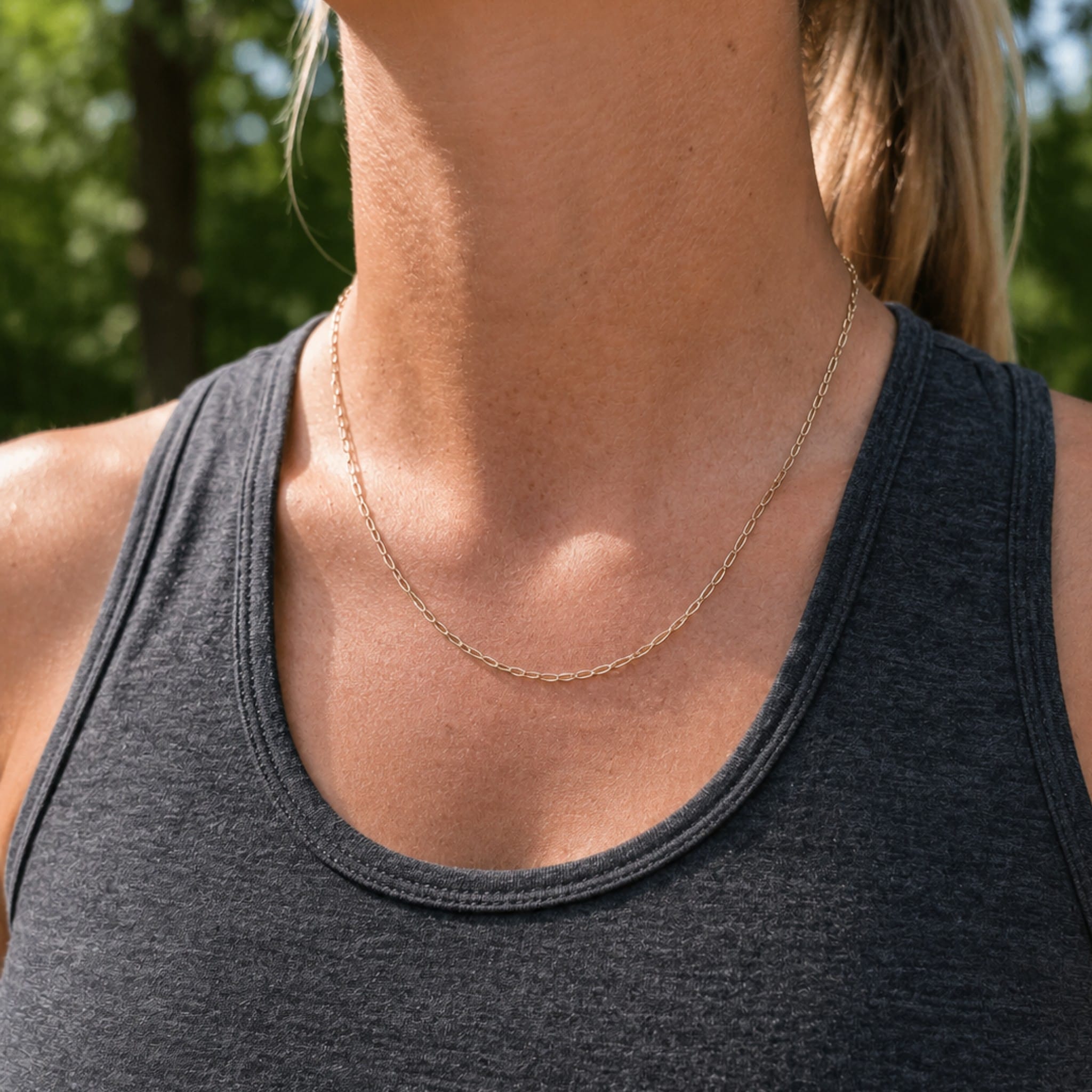 model wearing paperclip chain outdoors